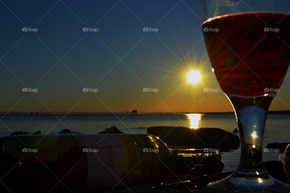 Red wine on the beach-sunset. Wine and cheese at the beach at sunset in souther Australia with a yummy red Australian Shiraz 