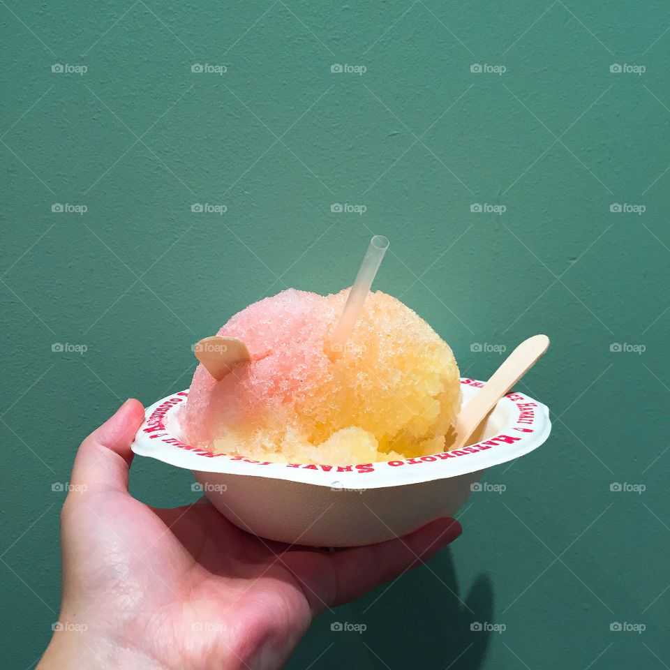 Holding colorful shaved ice