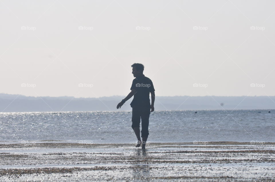 Man walking in sea
