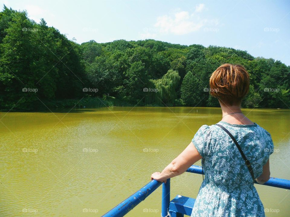 girl on the nature near the lake