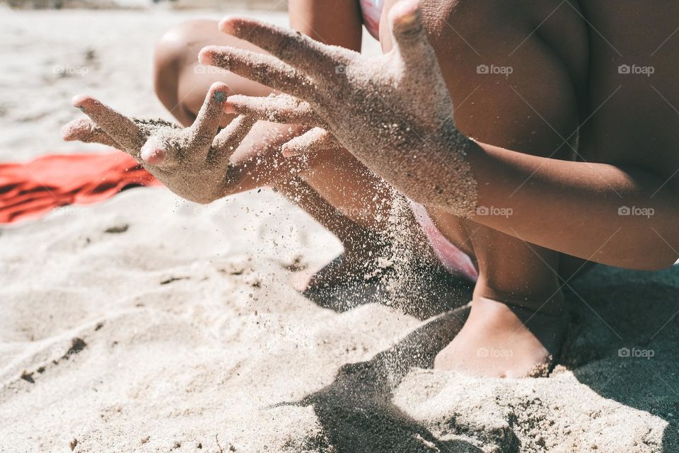 playing with the sand