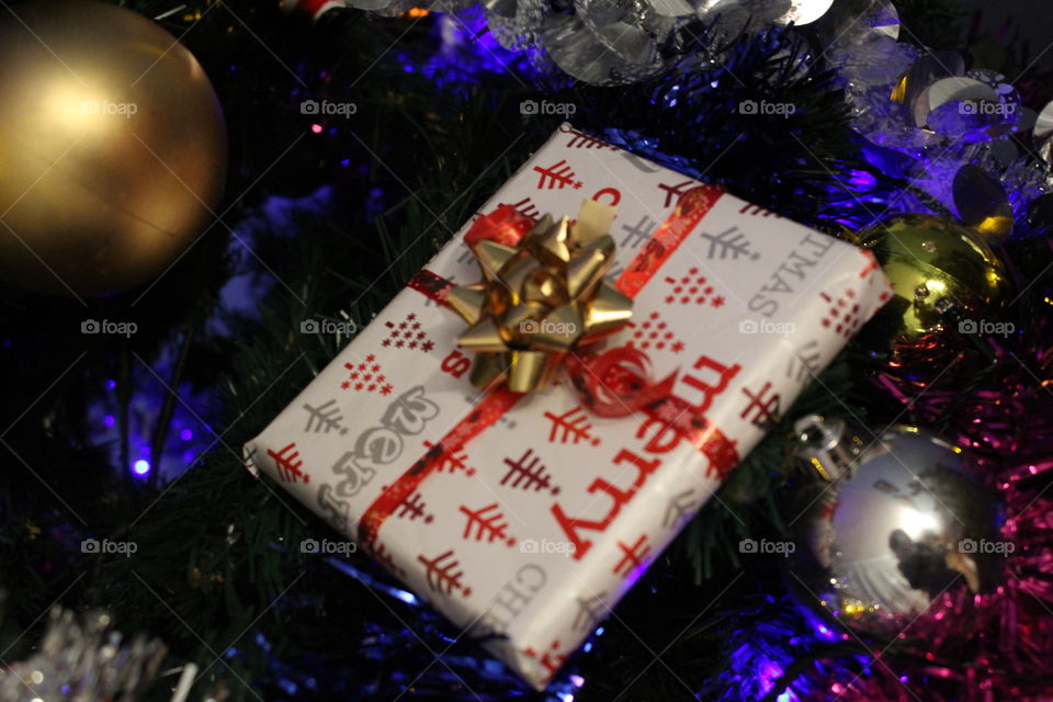 Christmas present on christmas tree