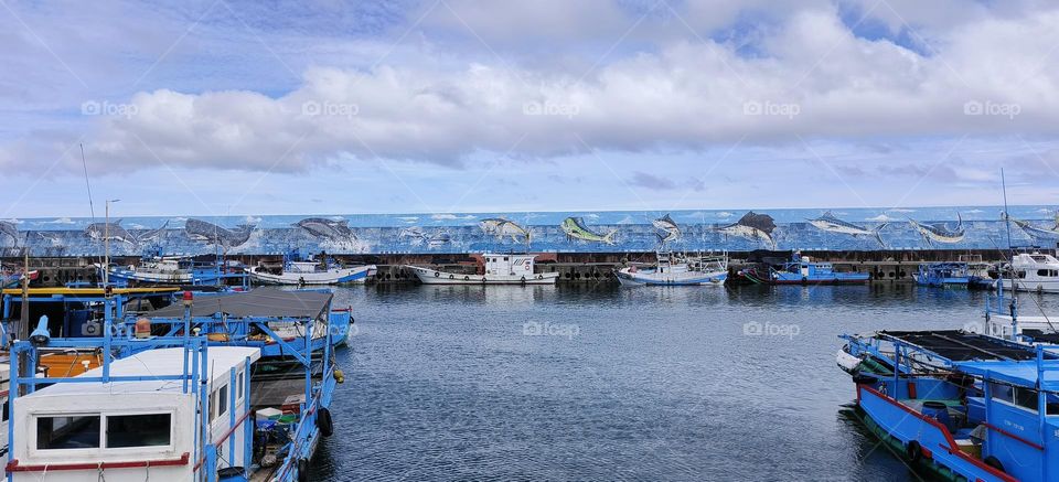 boats moored in fishing port