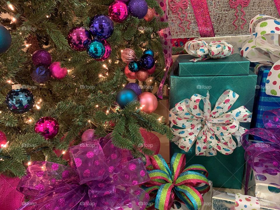 Christmas presents under the lighted decorated tree.