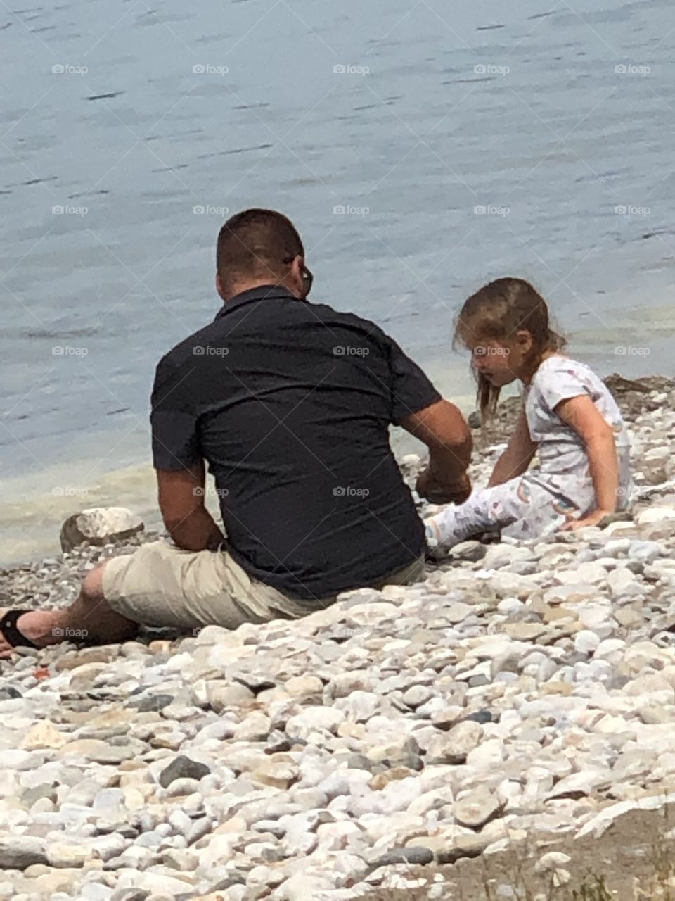 Father And Daughter Playing Together On Beach