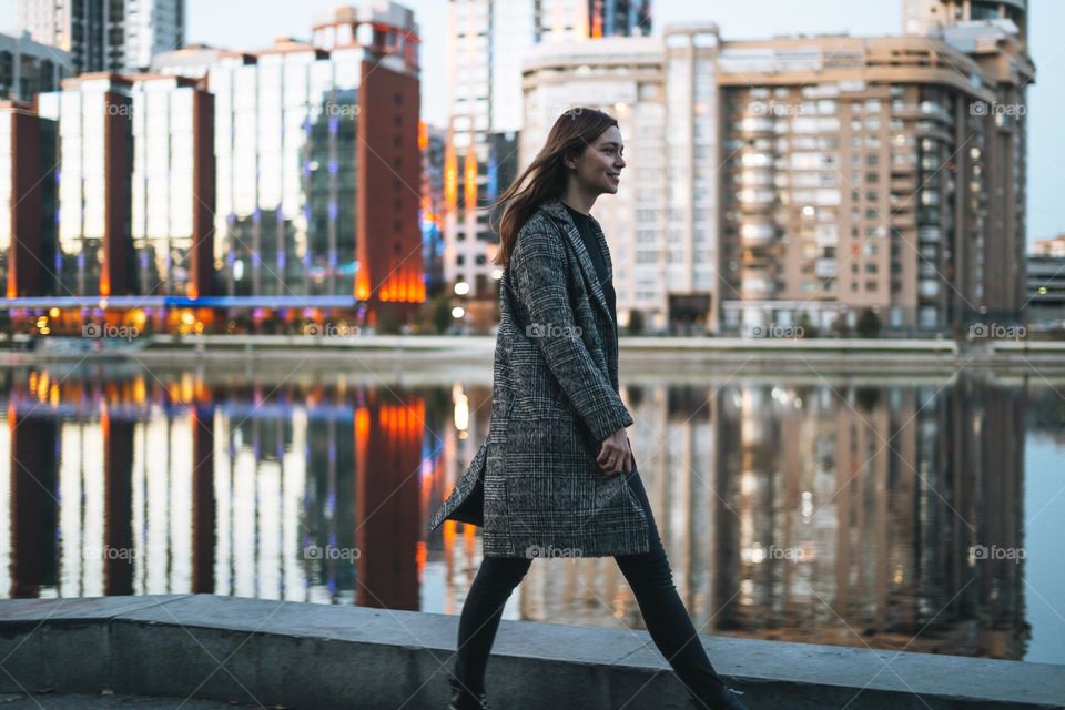 Young woman on background of night city 