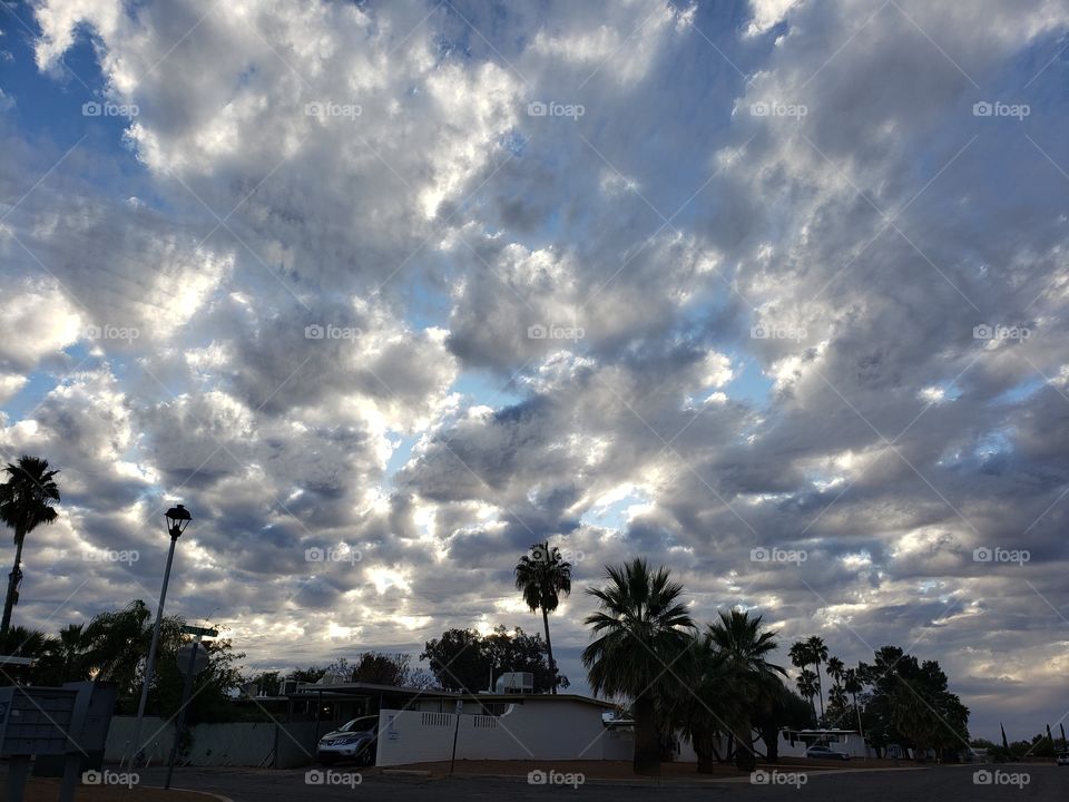 look at those beautiful clouds in the sky. love to see the paintings above.