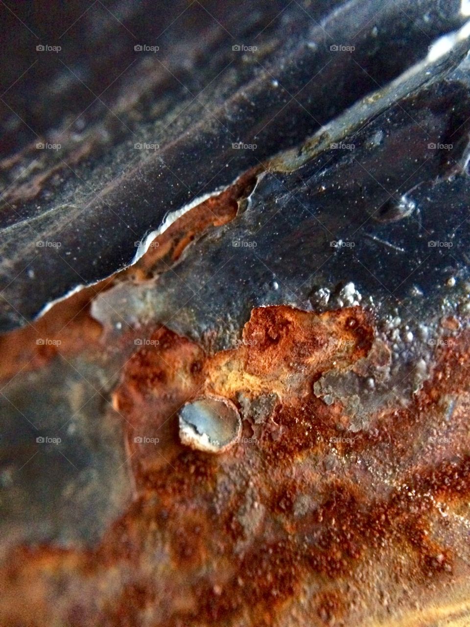 15X macro shot of rust on a gate fence 