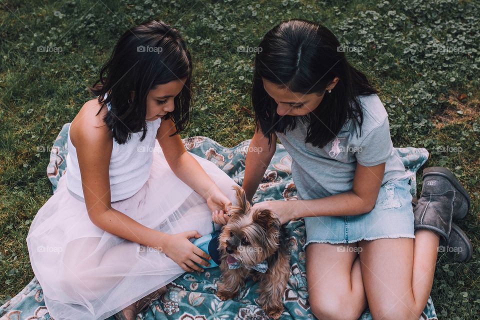 Sisters with their dog 