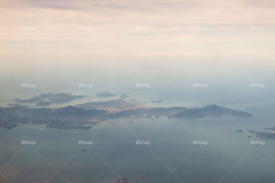 Scenic view of island in foggy weather