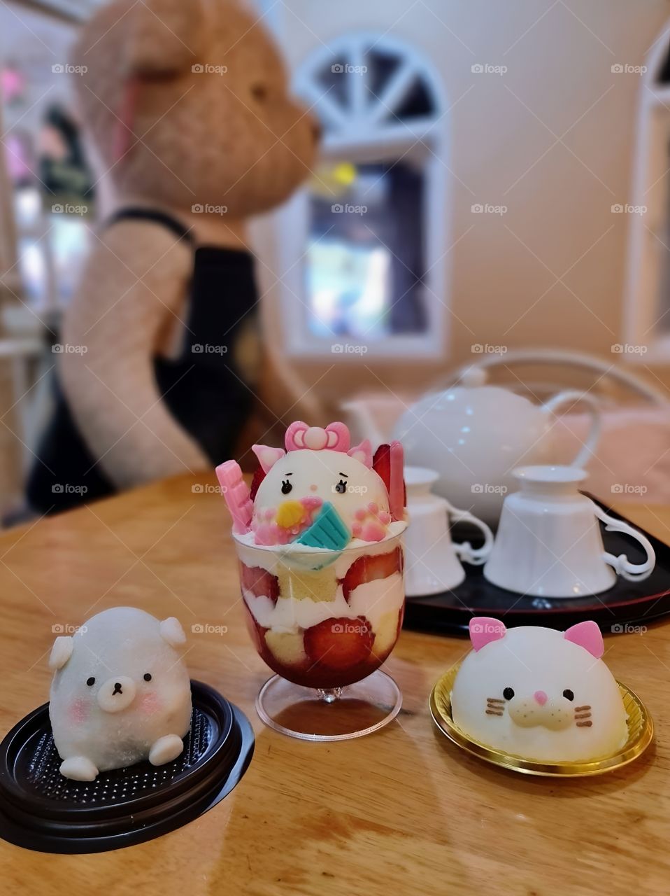 cute strawberry ice cream on the table with cute snacks