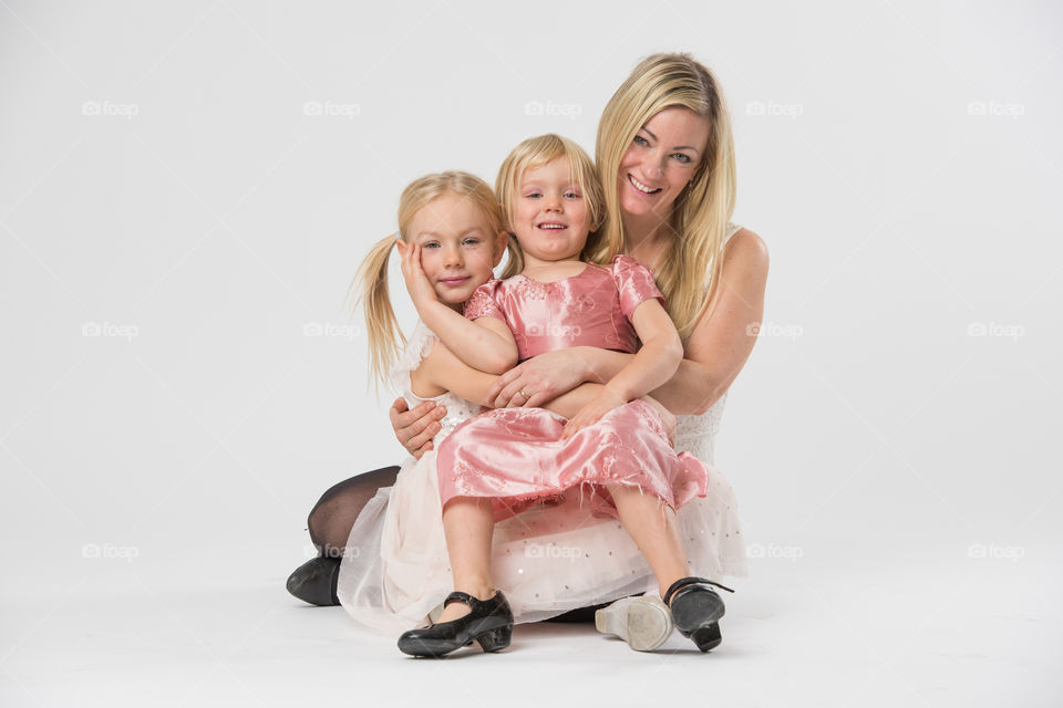 Happy family, mother with her two daughters of 6 and four years old.