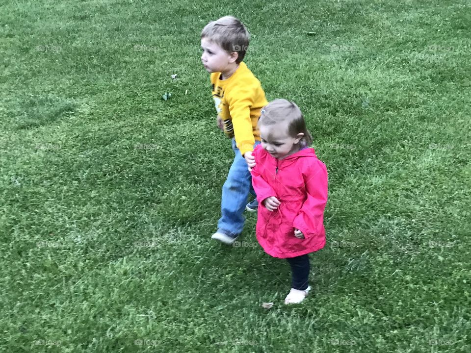 My son Marshall trying to hold his sisters hand but she's not having it lol