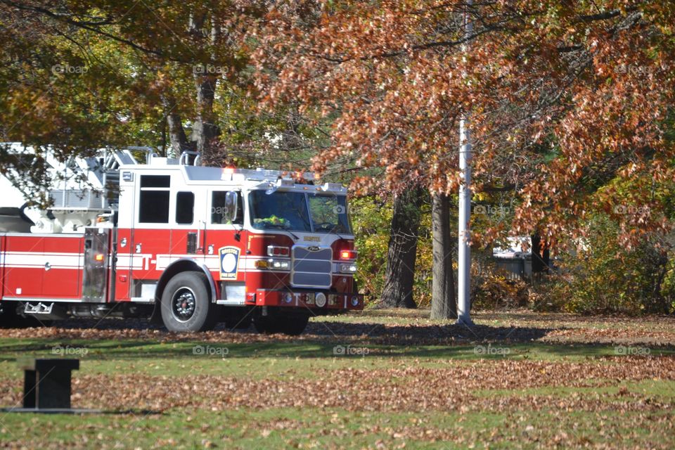 Firefighters rushing to fight a fire