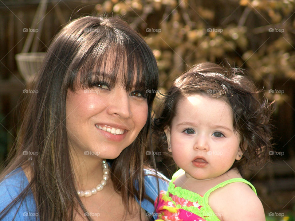 Mother and Daughter . Mother and baby girl posing.