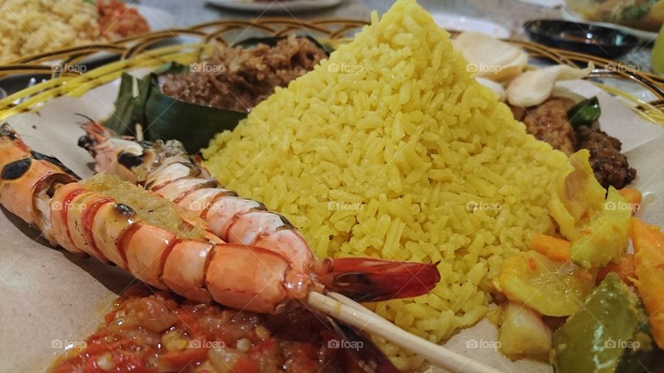 Yellow rice with bbq  prawns