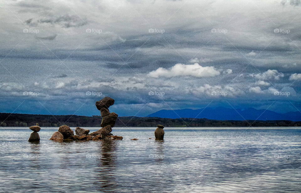 Balance boulder rock in sea