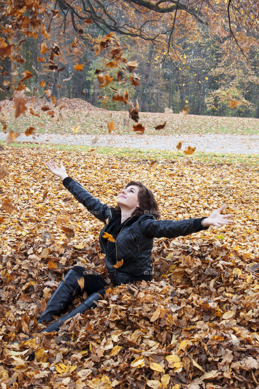 women and falling leaves