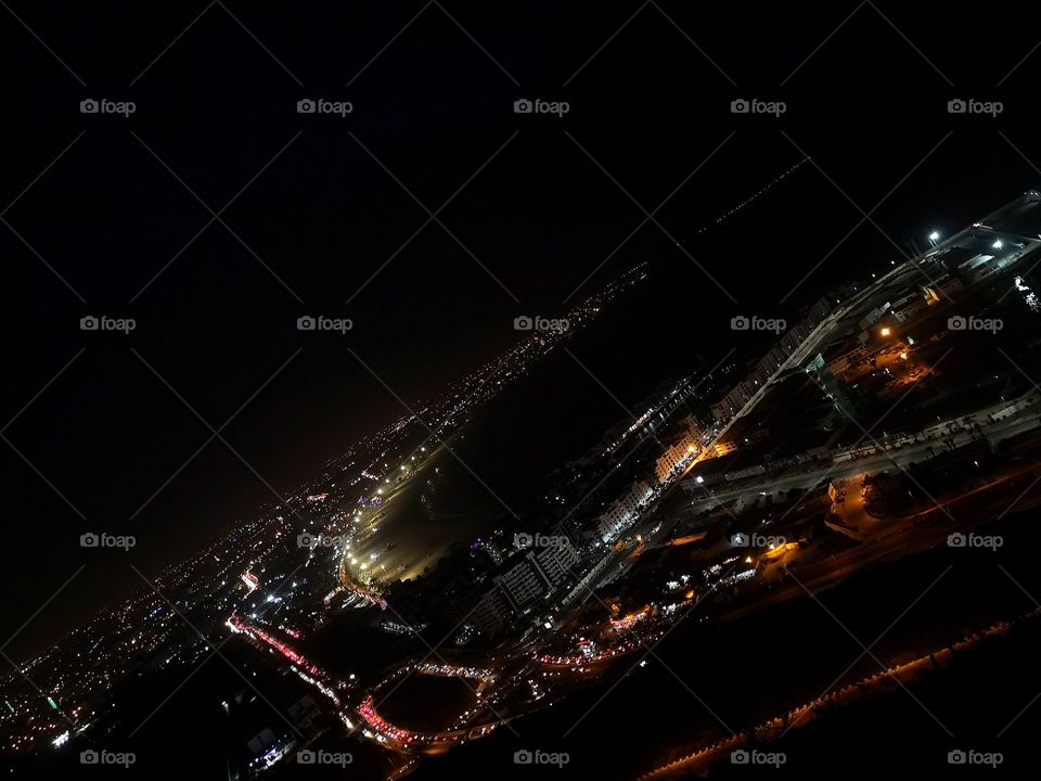 from the highest mountain in agadir which it has a view of the whole city and the beach it's called agadir oufella pictured at summer night