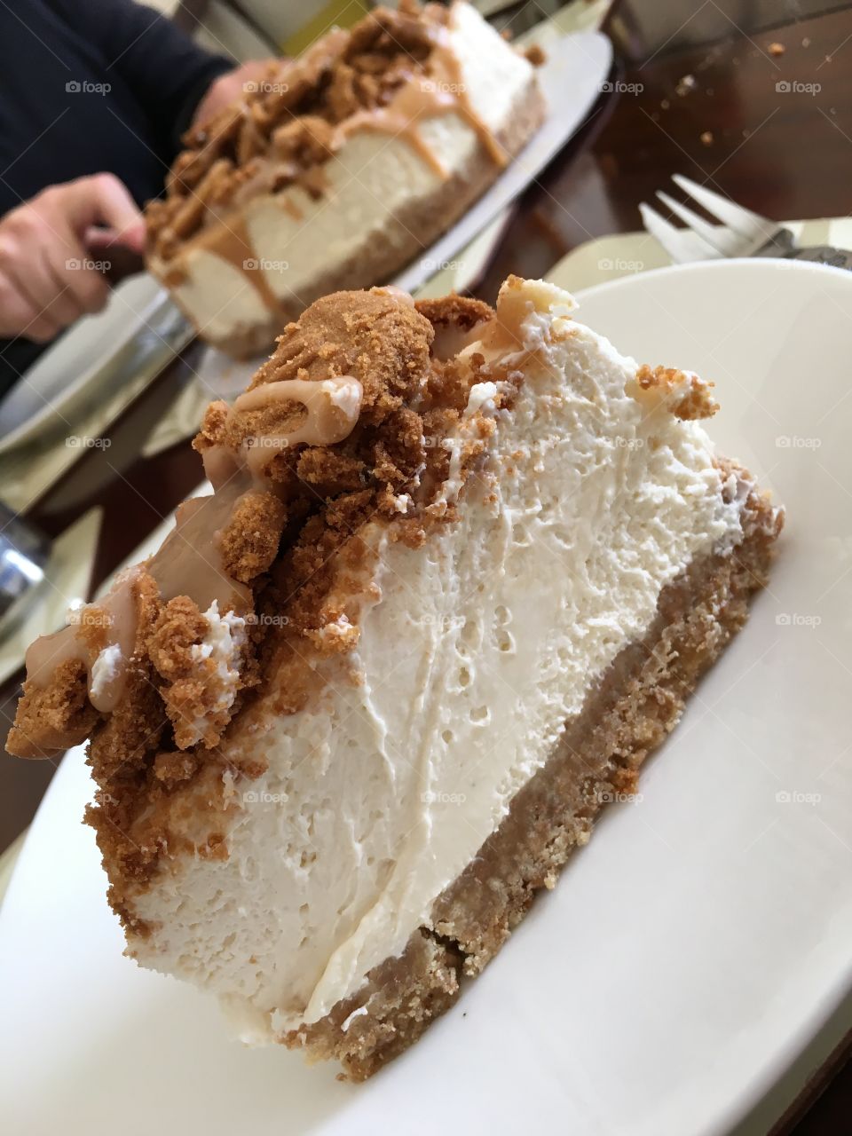 Sharing a divine cheesecake dessert. 