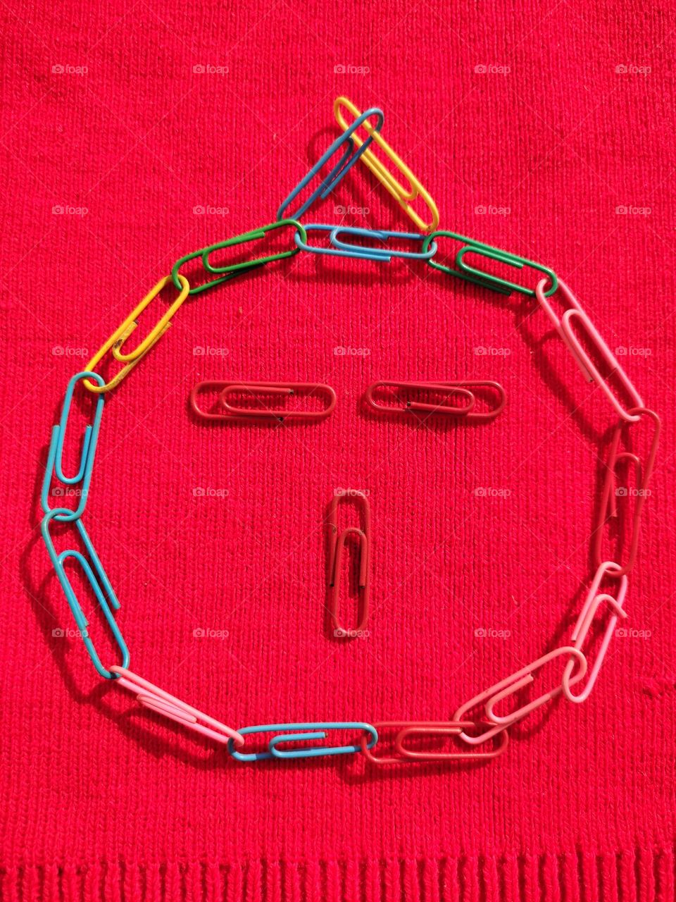 funny face made of metal paper pins
