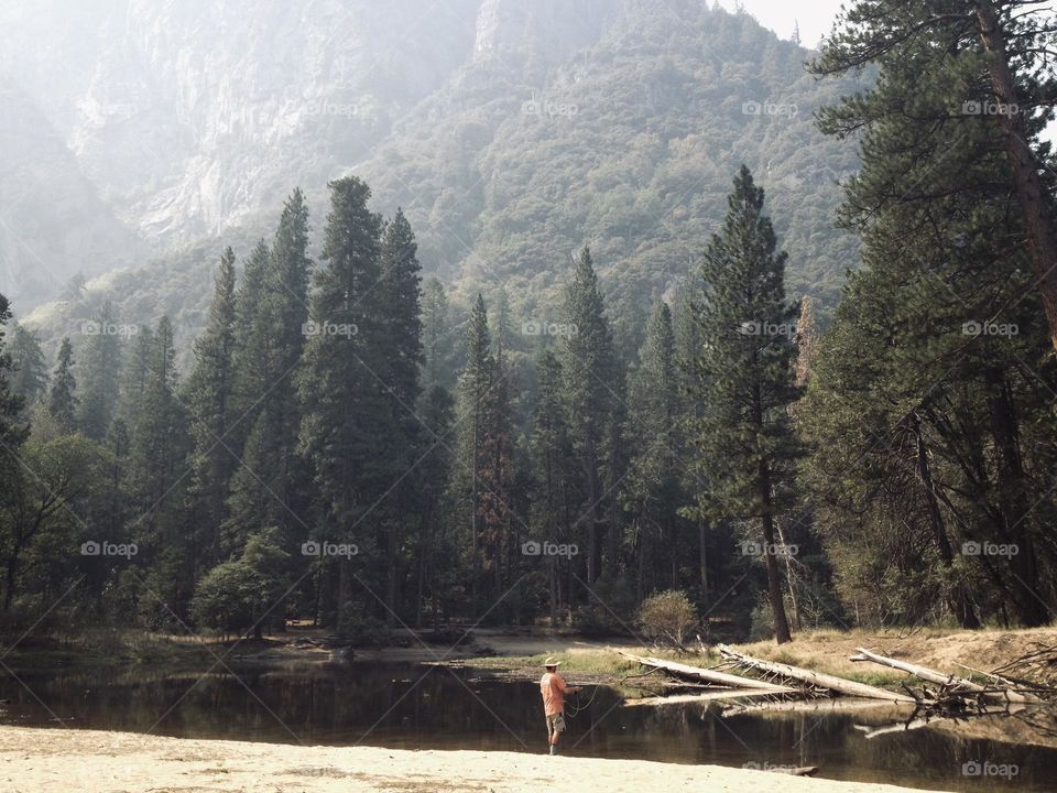 Fishing at the lake in the forest