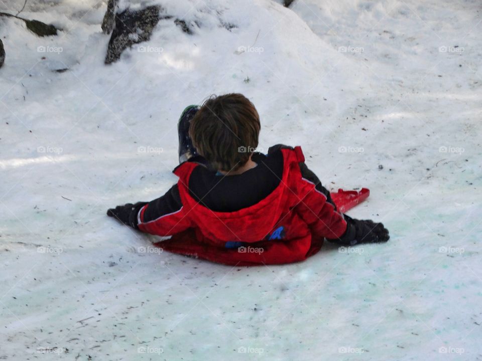 Boy Playing In The Snow