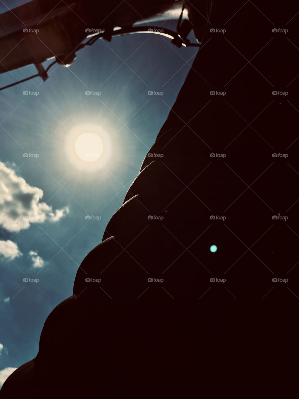 Sun behind a vactor truck pipe