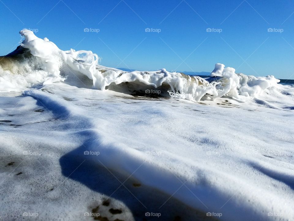 Seafoam shorebreak in Santa Cruz