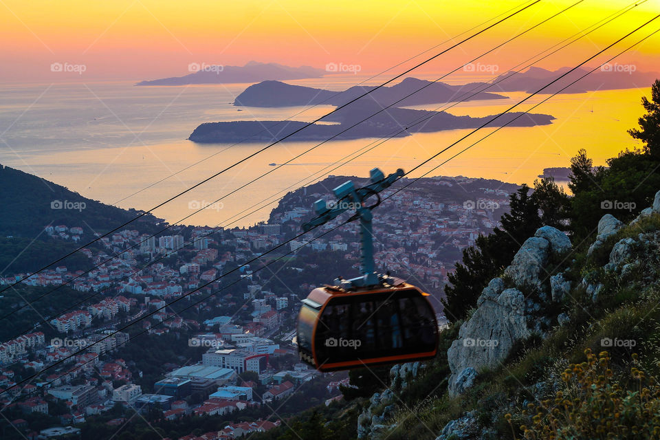 View of overhead cable car on mountain