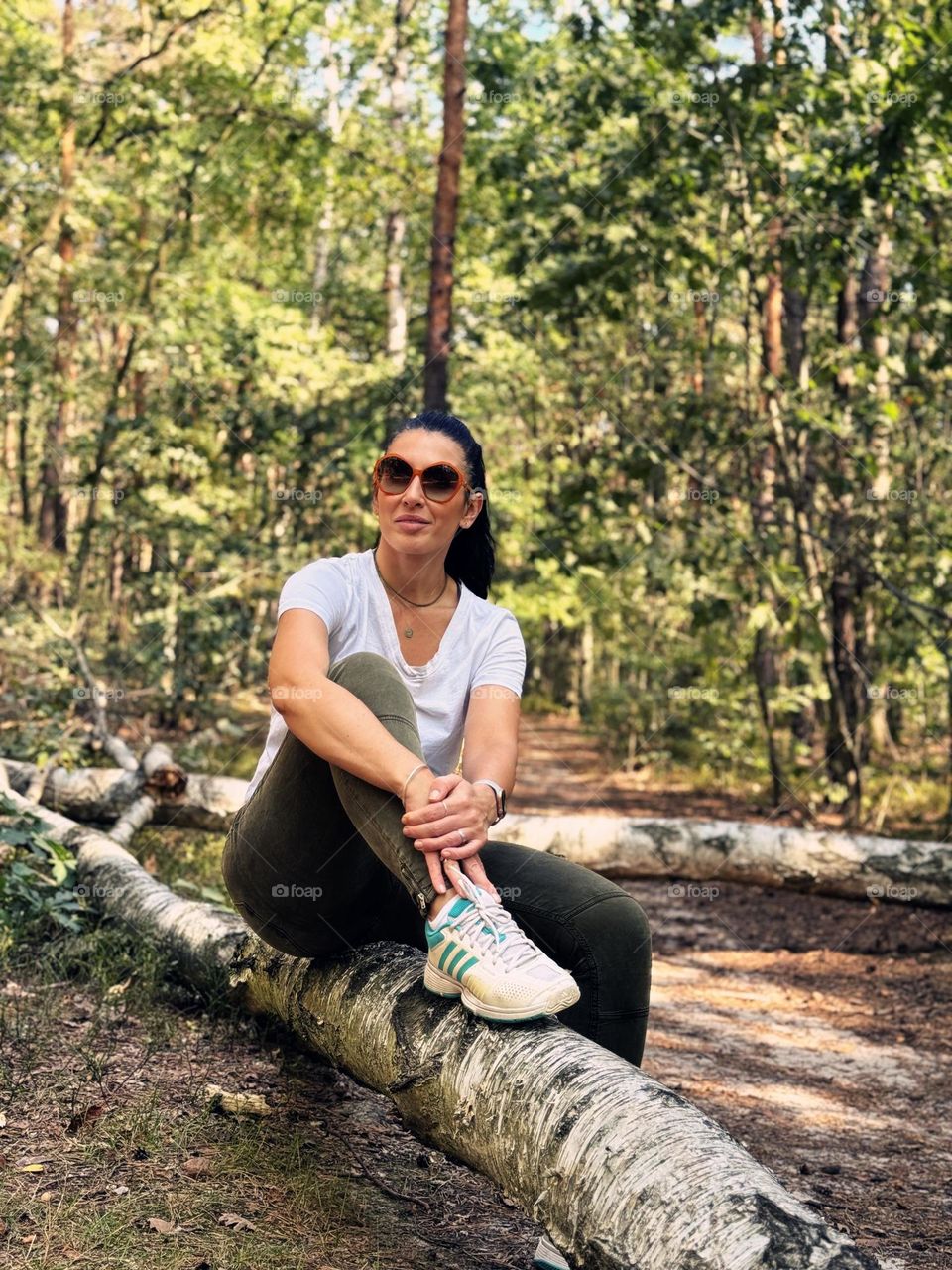 Woman sitting in a forest