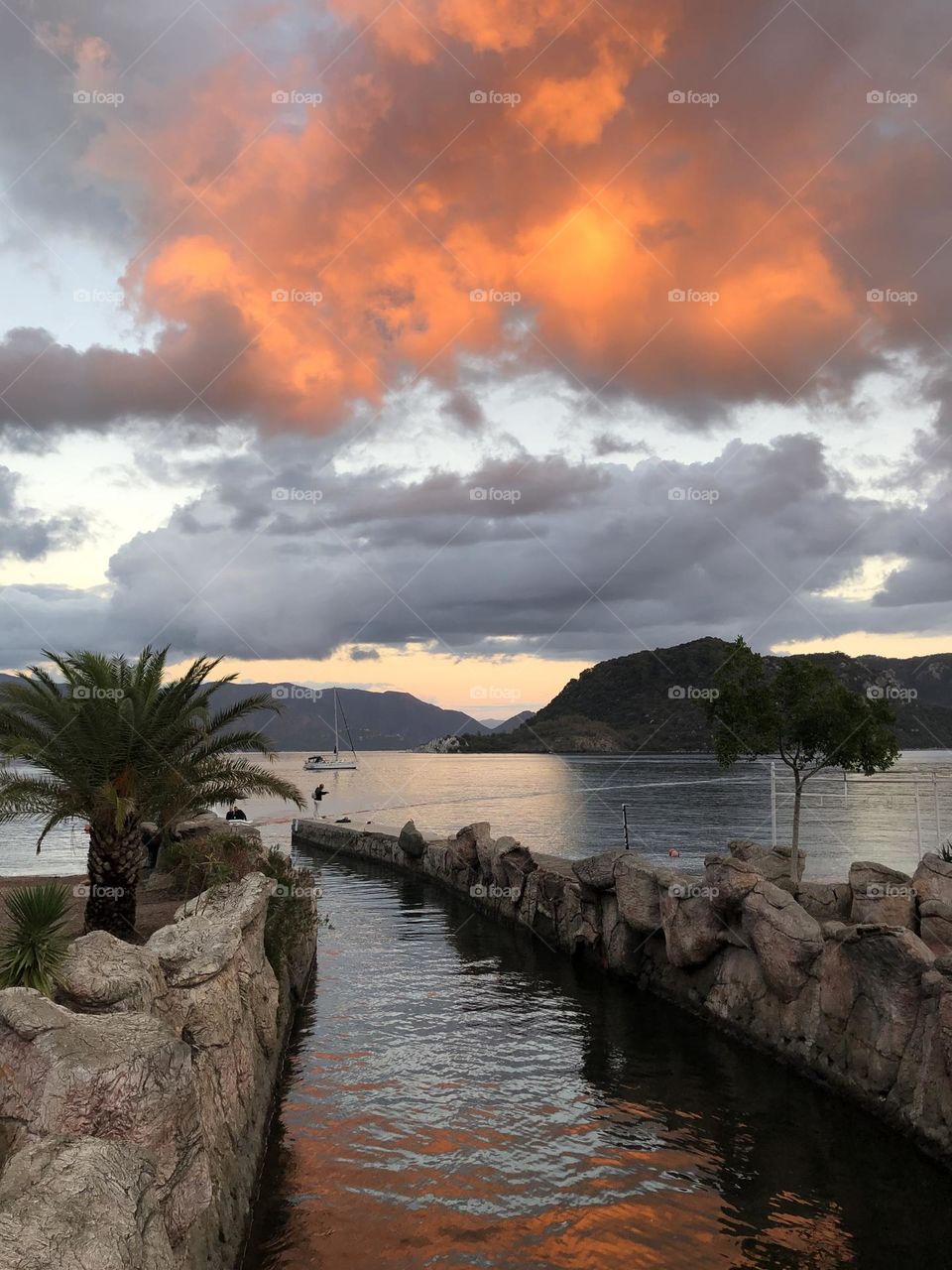 İçmeler sunset in a Mediterranean bay. exiting unbelievable Orange clouds, palms, exotic, turkey 