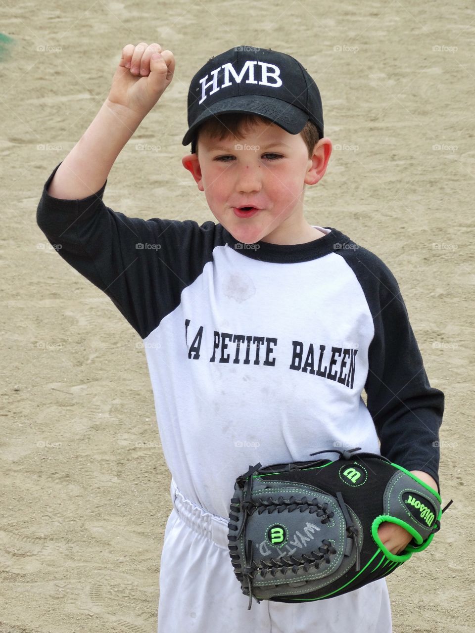 Young Baseball Player. Happy Young Boy Playing Baseball
