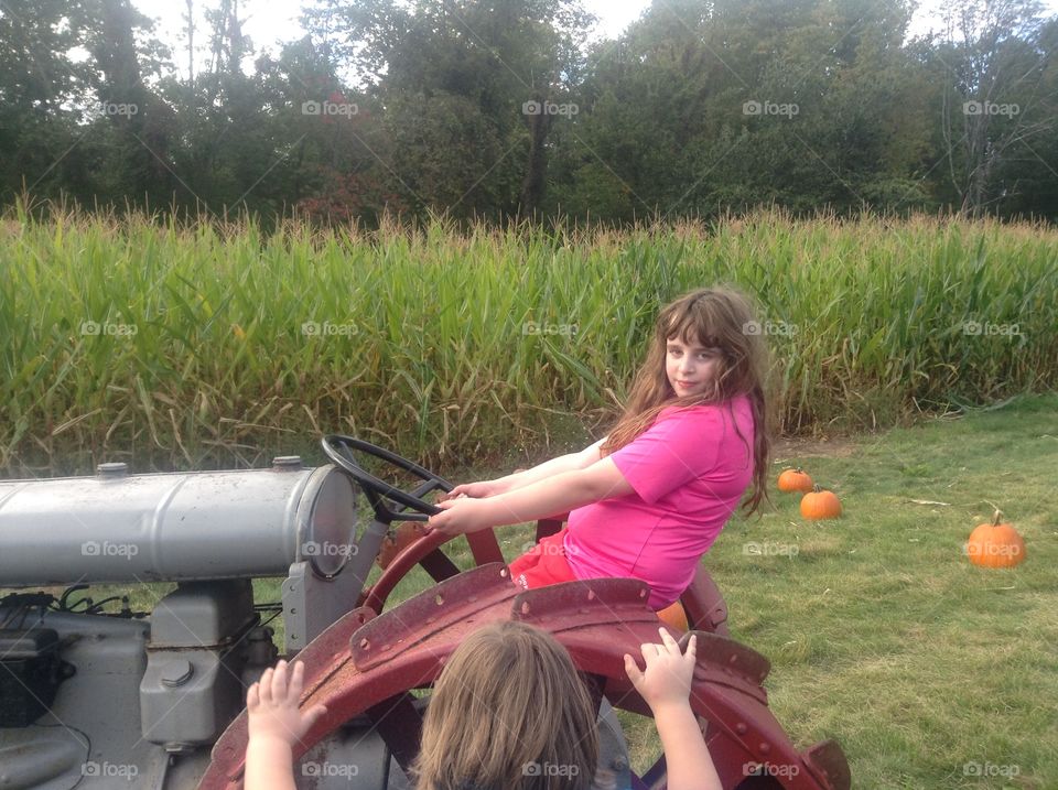 Girl on tractor