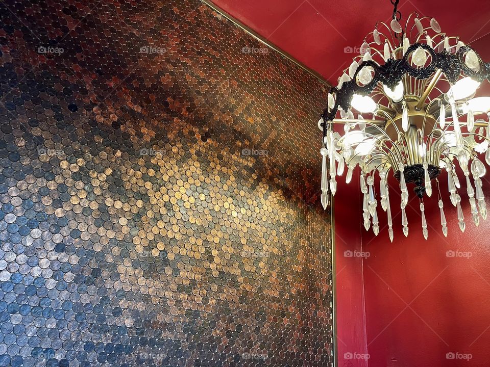 Entrance to a bar with a wall made of pennies. 