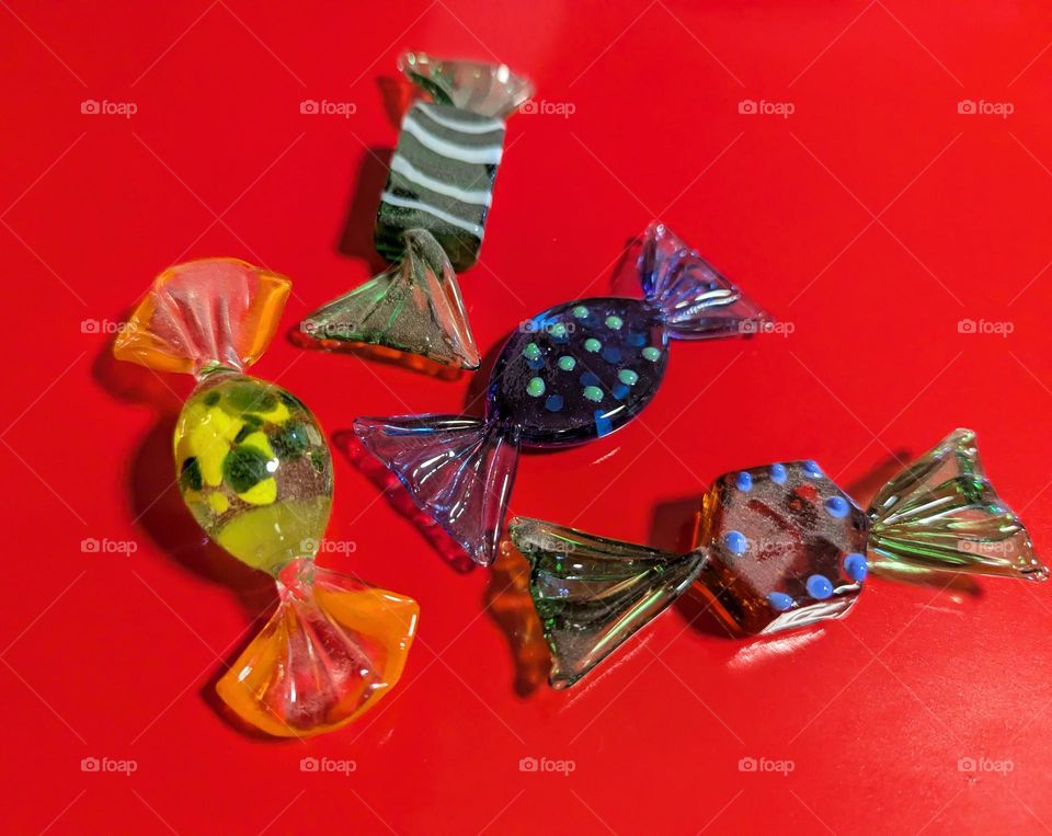 Green candy on a red background