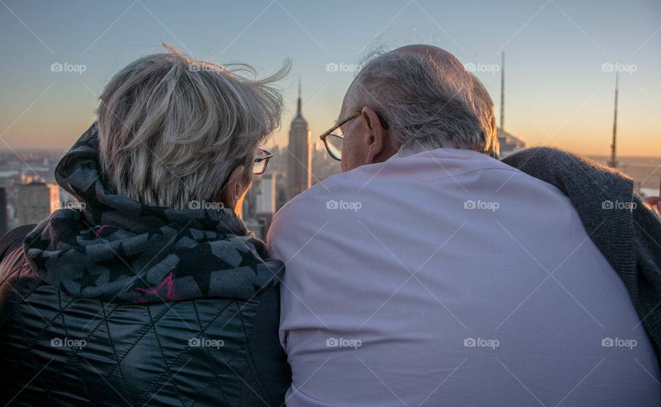 A couple enjoying the view from the Top Of The Rock!