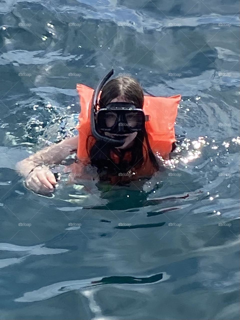 Snorkeling in the deep blue sea. Summer fun on the coast of Cabo San Lucas.