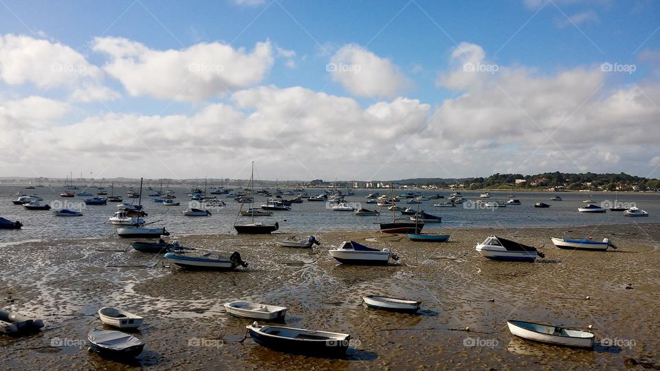 Boats anchor at low tide