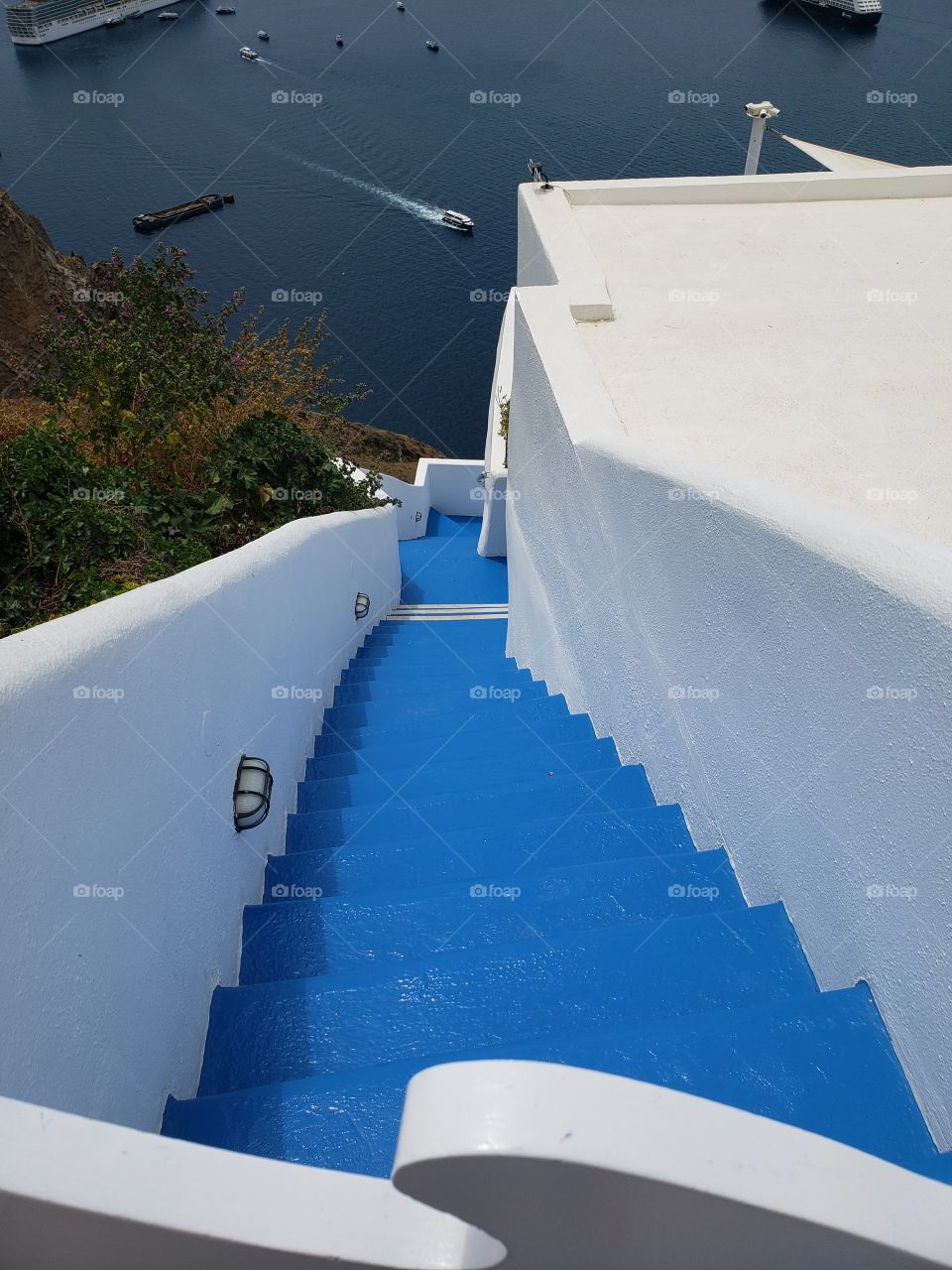 View from above, looking down blue colored staircase in Santorini, Greece, Europe.