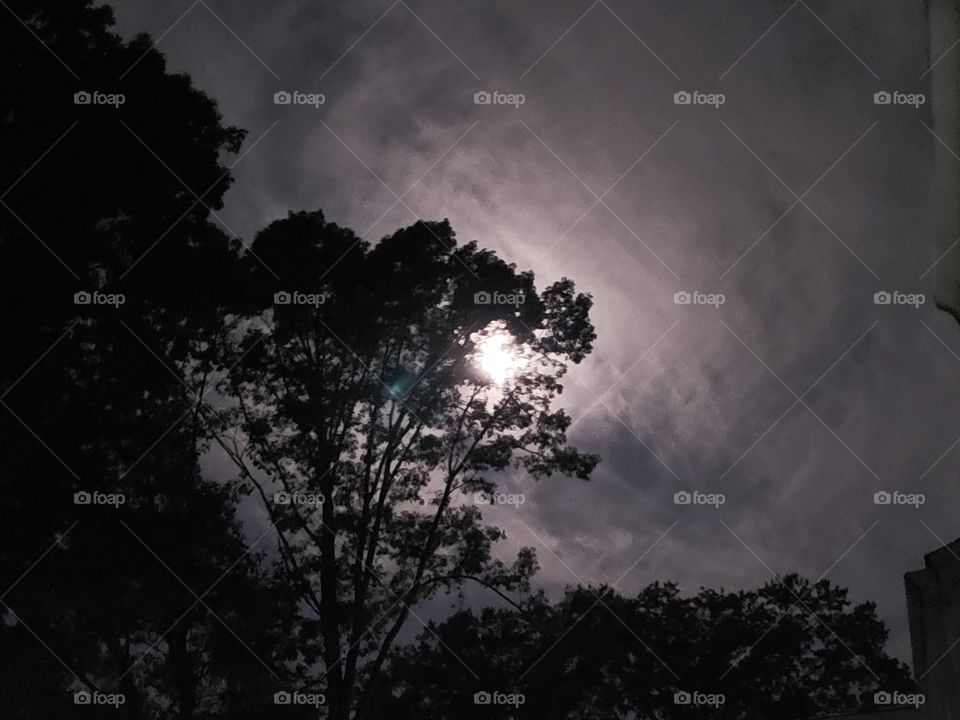When the moon beckons - A bright and erie moon and clouds