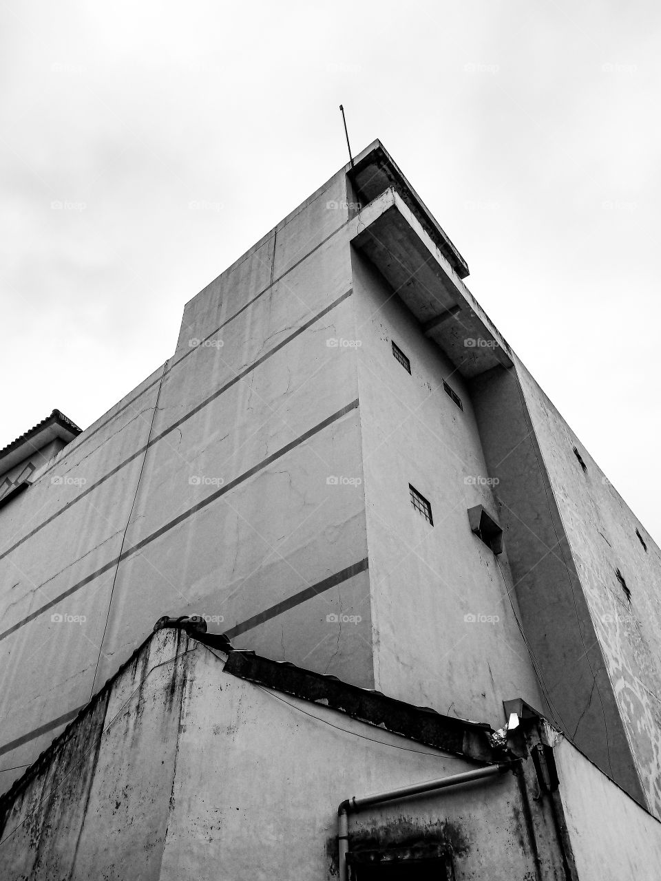 Old building and cloudy it makes look creepy.