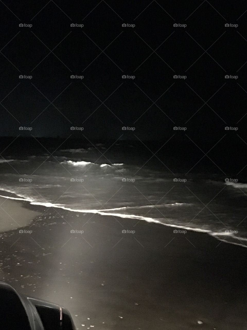 Low tide at the ocean at night