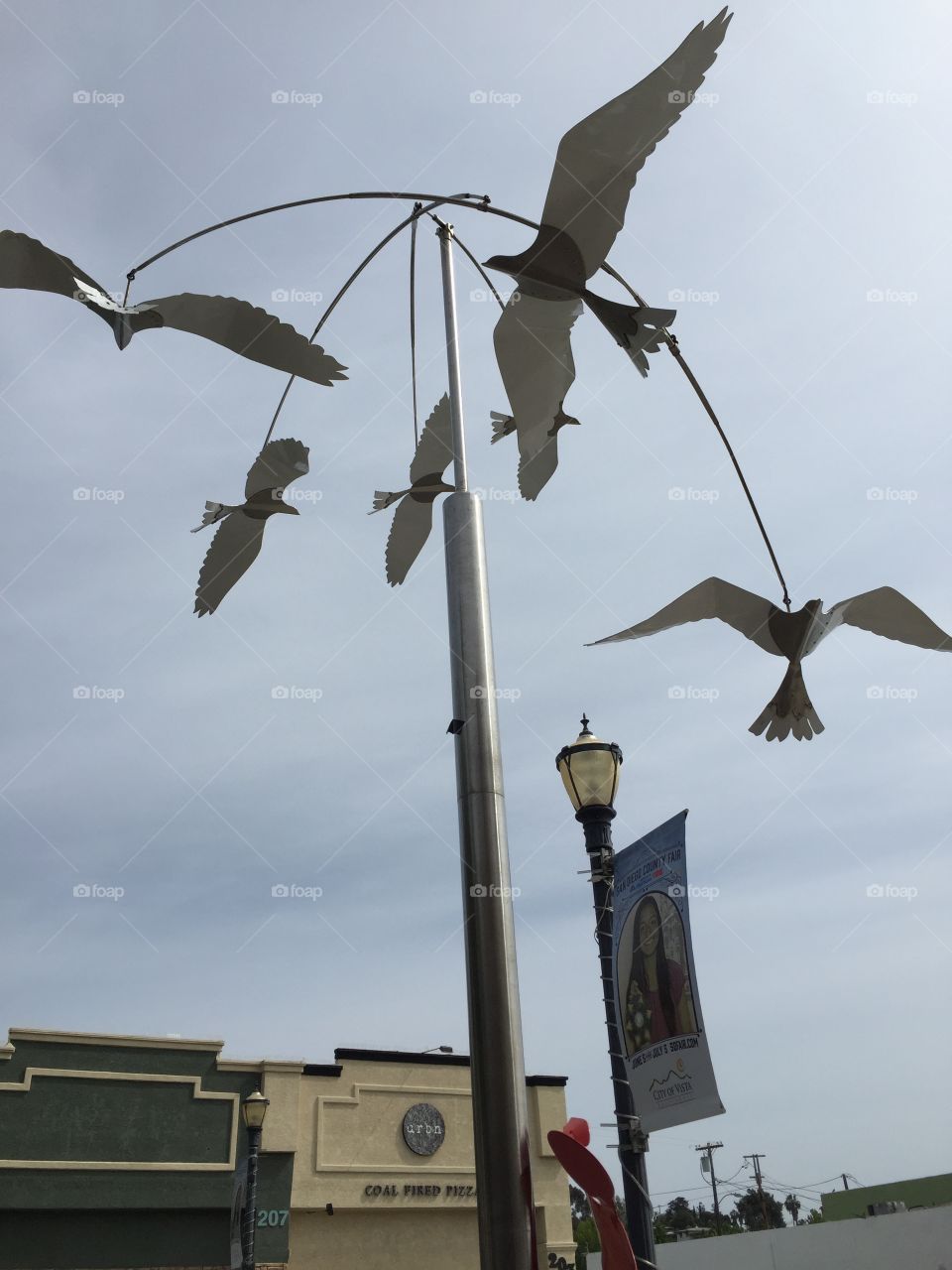 Overhead bird mobile . Metal art piece of birds. The birds move in the breeze