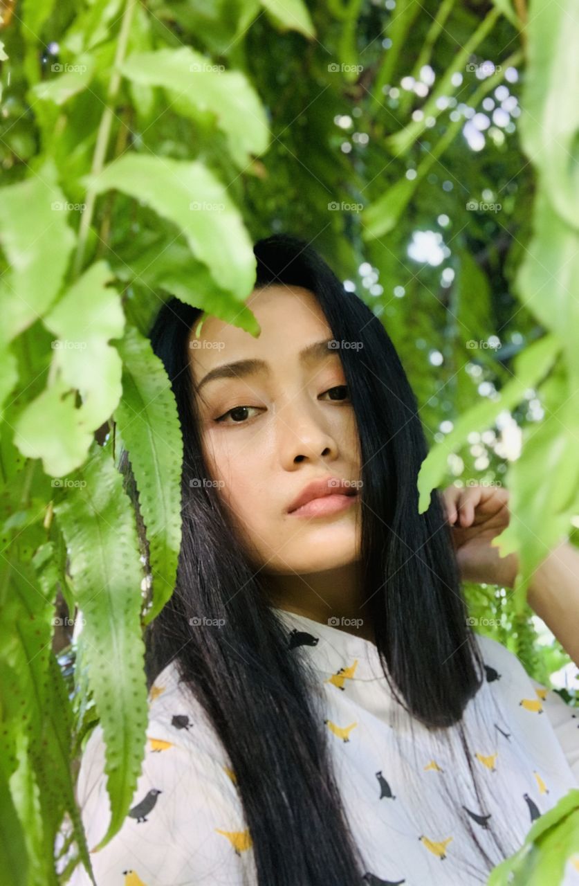 A girl with plants around 