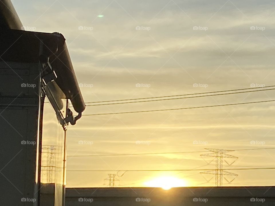 Beautiful Sunday Morning Sun Peaking just over bridge. Photo taken from Inside RV 