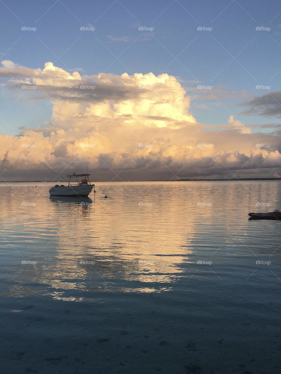 Morning cloud on calm water of Polynesia atoll