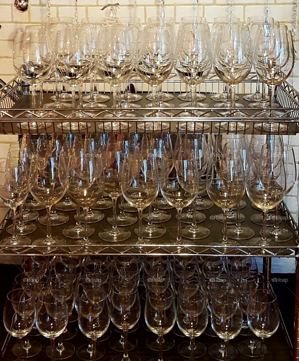 Get ready to serve lots of wine!  Sparkling clean wine glasses stacked and ready.
