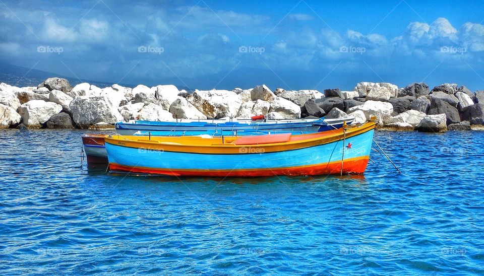 Multicolor boats floating on sea