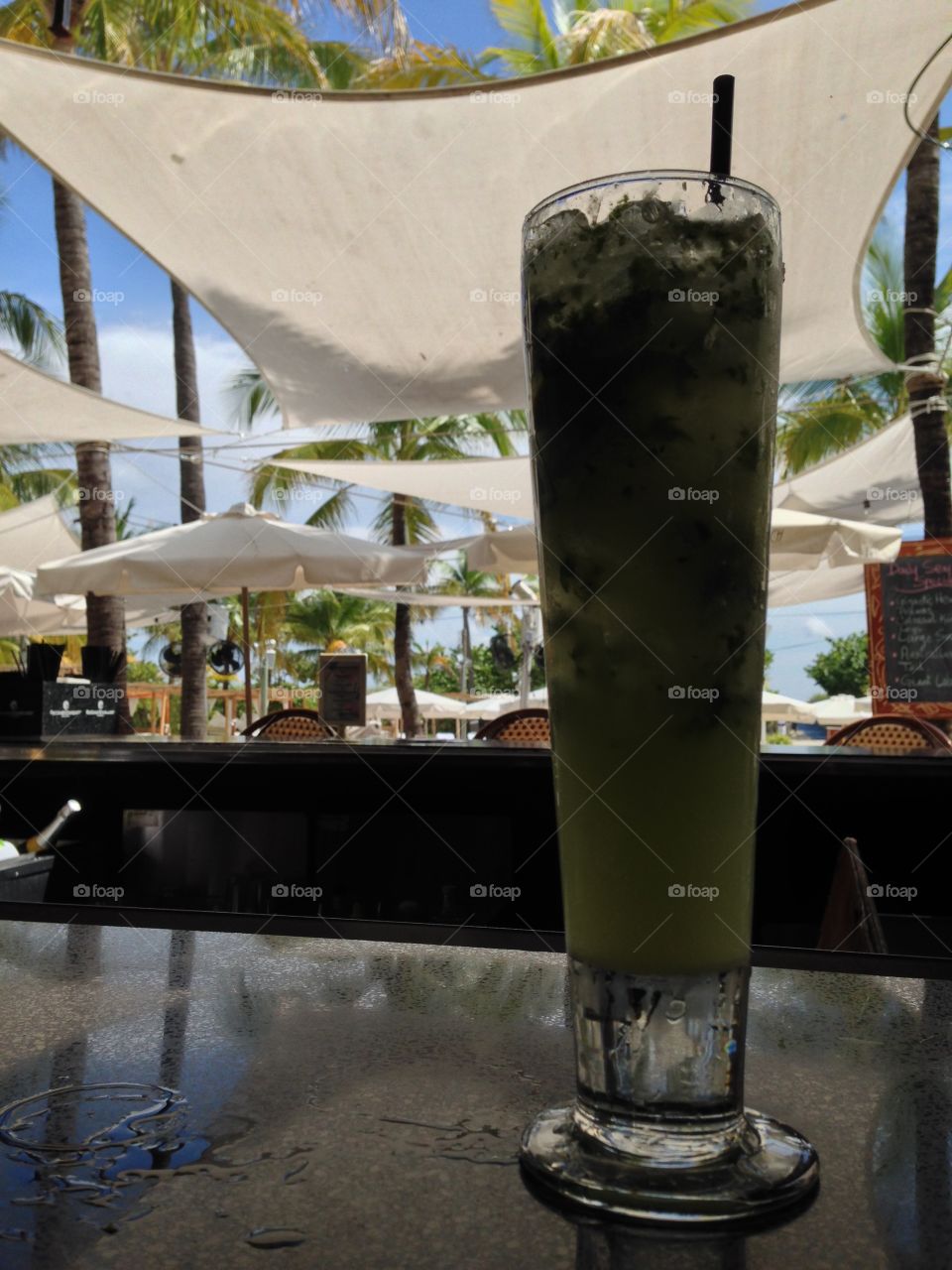 Mojito a day keeps the doctor away , having a drink at Nikki beach club , Miami Florida 